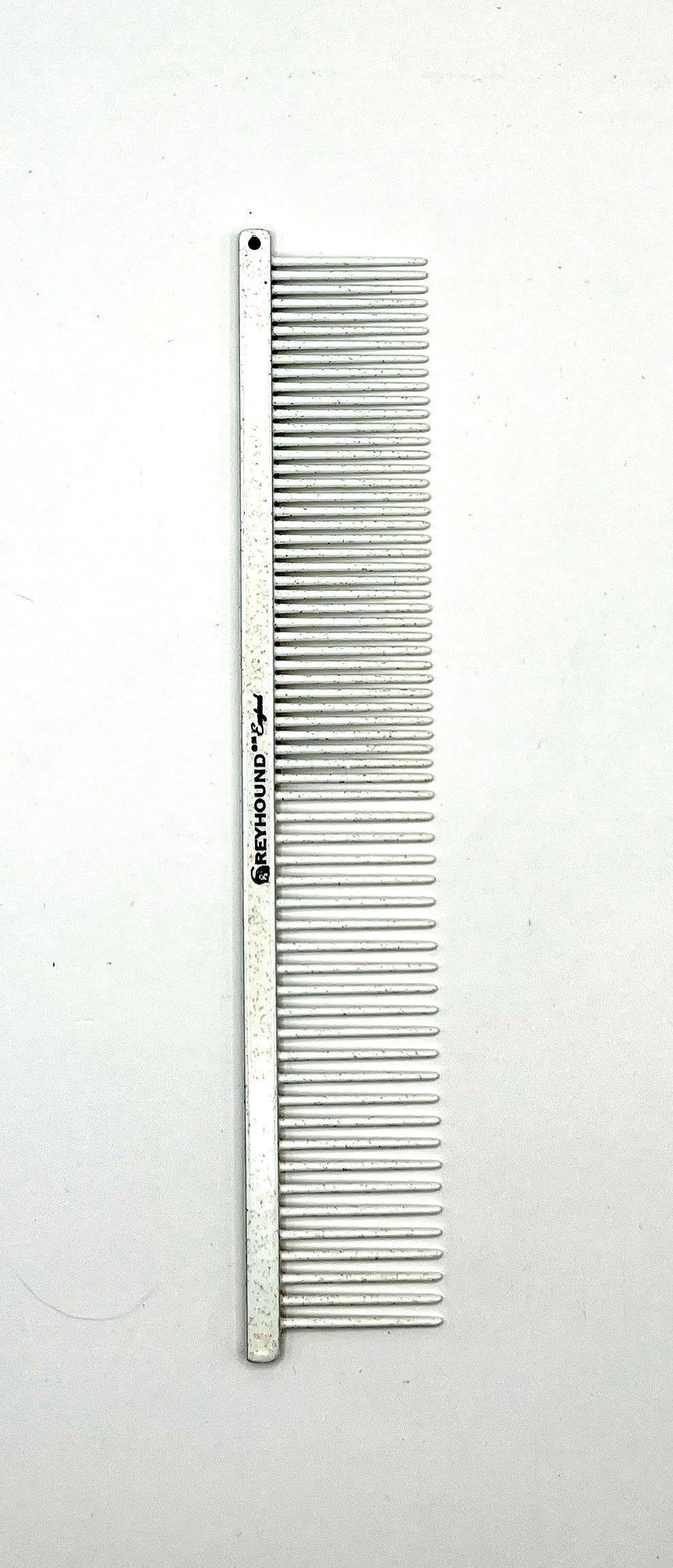 The patented Greyhound Comb Beauty Collection features a 7.6"L x 1.4"W fine to medium tine combination which gives superior styling control for all coat types. These versatile combs have been a staple of the pet grooming industry for over 100 years. Sparkle colored finish collection. White.