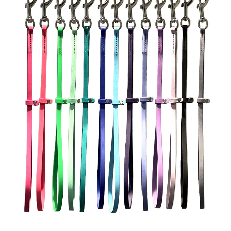 These patent pending grooming loops are 18" long and made from USA manufactured and produced heavy duty BioThane Beta 520. This durable, non-porous material is ideal for long lasting, odor free grooming equipment. The polyester nylon webbing core covered with a TPU coating, making it strong and flexible. Heavy stitching allows for the material to hold up to all types of tugging. All Colors.