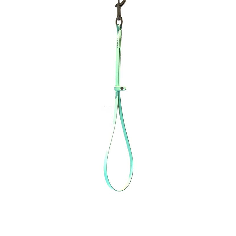 These patent pending grooming loops are 18" long and made from USA manufactured and produced heavy duty BioThane Beta 520. This durable, non-porous material is ideal for long lasting, odor free grooming equipment. The polyester nylon webbing core covered with a TPU coating, making it strong and flexible. Heavy stitching allows for the material to hold up to all types of tugging. Mint.