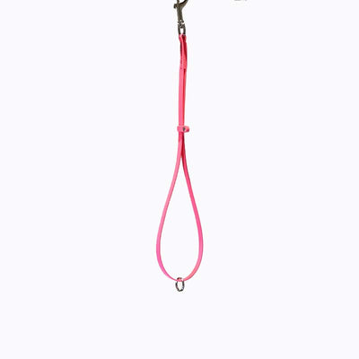 Groomerverse 18" grooming loops with an additional safety ring are perfect for table to tub use. The safety ring allows for the loop to be attached to our biothane safety tether. Avoid having to work with several different styles of loops. Biothane is easy to clean, odor resistant and comes in a variety of colors allowing for visual organization or a stylized workspace. Hot Pink.