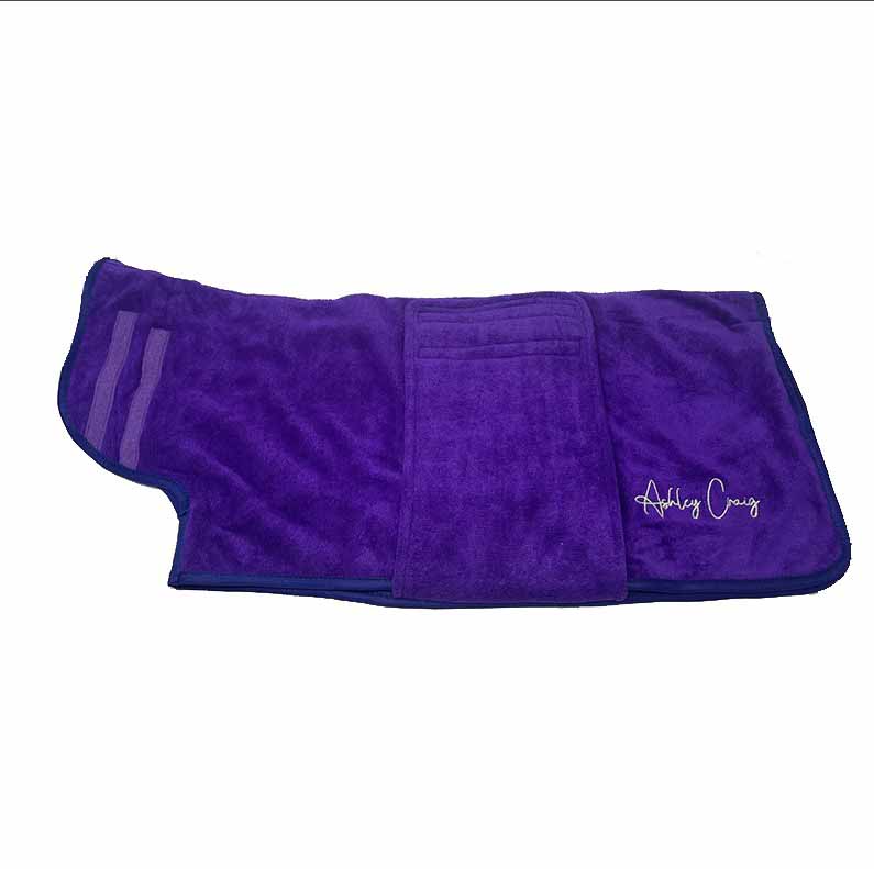 Ashley Craig has created a double-thickness velvet microfiber, pet robes which can absorb up to 50% more water than other microfiber towels, significantly reducing drying times. Ideal for preparing wire hair and flat coated breeds for show. Each robe has a secure Velcro closure and fits over the head with ease. Purple.