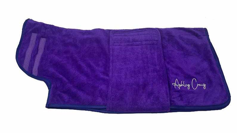 Ashley Craig has created a double-thickness velvet microfiber, pet robes which can absorb up to 50% more water than other microfiber towels, significantly reducing drying times. Ideal for preparing wire hair and flat coated breeds for show. Each robe has a secure Velcro closure and fits over the head with ease. Purple.