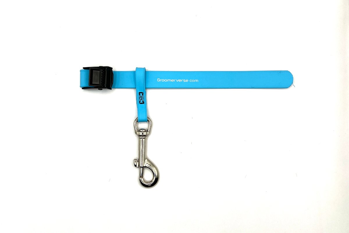 Our water proof, odor resistant USA Made Biothane pet safety tethers fit snuggly around table arms and clip securely to the ring on our Biothane grooming loops. Light Blue