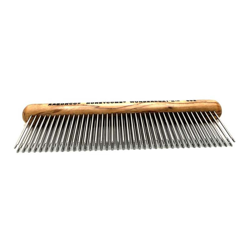 The Aaronco®  Wundercoat'R™ Grooming Comb was developed by industry leader Sam Kohl, This revolutionary 7" design has 3 rows of 1.75” tines created to remove dense undercoat, and reduce excess topcoat. Its ergonomic wooden handle reduces wrist and hand strain, while its tines offer increased coat removal compared to brushing alone, without resulting in damage to the fur or skin.