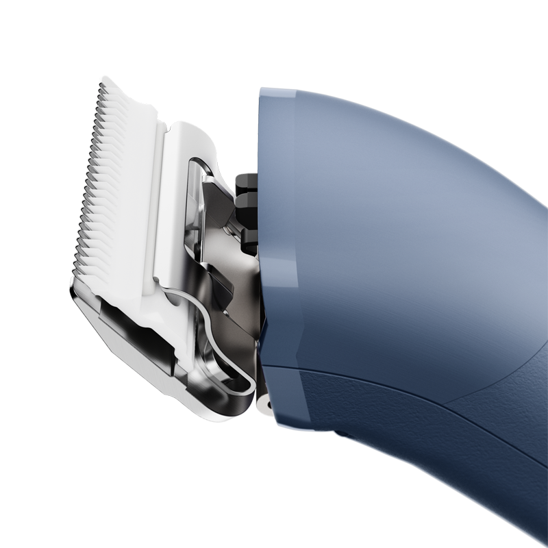 The new Andis eMERGE™ professional pet clipper in blue was designed for groomers who need and want high speed and power. This single-speed clipper will cut through any coat. The powerful rotary motor achieves 4500 SPM and works with a detachable blade system with wide compatibility make maintenance a breeze. The cord/cordless flexibility and shape with a contoured body and finger grooves helps increase control and reduce hand strain. Side view.
