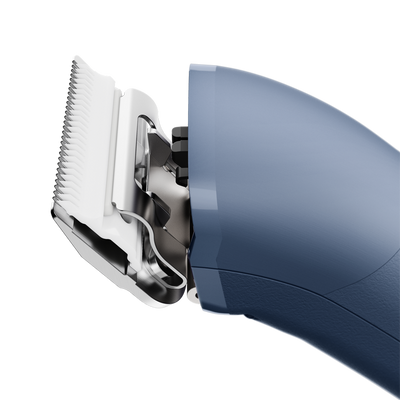 The new Andis eMERGE™ professional pet clipper in blue was designed for groomers who need and want high speed and power. This single-speed clipper will cut through any coat. The powerful rotary motor achieves 4500 SPM and works with a detachable blade system with wide compatibility make maintenance a breeze. The cord/cordless flexibility and shape with a contoured body and finger grooves helps increase control and reduce hand strain. Side view.