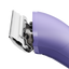 The new Andis eMERGE™ professional pet clipper in light purple was designed for groomers who need and want high speed and power. This single-speed clipper will cut through any coat. The powerful rotary motor achieves 4500 SPM and works with a detachable blade system with wide compatibility make maintenance a breeze. The cord/cordless flexibility and shape with a contoured body and finger grooves helps increase control and reduce hand strain. Side view.