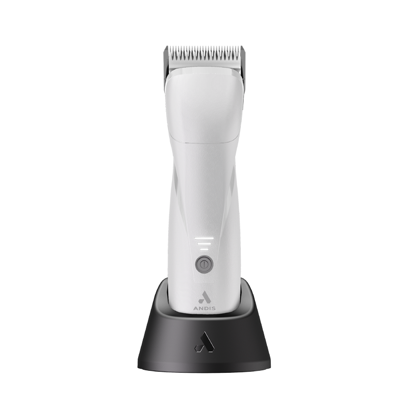 The new Andis Pro eMERGE™ professional pet clipper in London Fog White is now 20% lighter and 15% smaller than the original eMERGE™. The powerful brushless motor achieves 4,500 SPM and works with a detachable blade system with wide compatibility. The cord/cordless uses a revolutionary magnetic, swivel adapter cord that also fits easily in the charging stand. The contoured body includes extra finger grooves and the Lithium-ion Batter allows for up to 1.5 hours operating time. Stand shown.