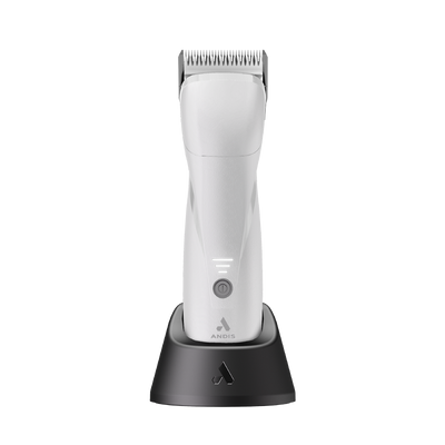 The new Andis Pro eMERGE™ professional pet clipper in London Fog White is now 20% lighter and 15% smaller than the original eMERGE™. The powerful brushless motor achieves 4,500 SPM and works with a detachable blade system with wide compatibility. The cord/cordless uses a revolutionary magnetic, swivel adapter cord that also fits easily in the charging stand. The contoured body includes extra finger grooves and the Lithium-ion Batter allows for up to 1.5 hours operating time. Stand shown.