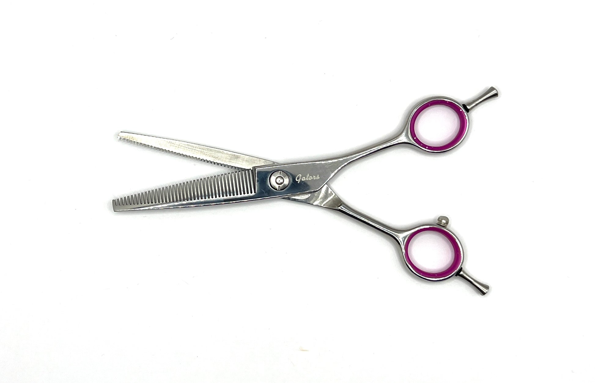 The Gator Series is an entry level collection made from a high-quality stainless steel alloy that allows for a razor-sharp edge and are specifically designed for cutting and finishing all types of coats. Combined with a ball bearing pivot with tension balancing spring , these shears are precisely weighted and honed to a razor-sharp edge for effortless scissoring, balance, and comfort. The ergonomic handles and fixed finger rest help prevent hand and wrist fatigue. 6.5"-40Tooth Dbl blender open.