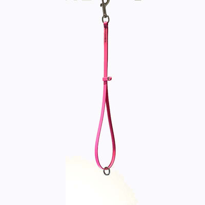 Groomerverse 18" grooming loops with an additional safety ring are perfect for table to tub use. The safety ring allows for the loop to be attached to our biothane safety tether.  Avoid having to work with several different styles of loops. Biothane is easy to clean, odor resistant and comes in a variety of colors allowing for visual organization or a stylized workspace.  Neon Pink.