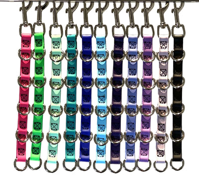 Groomerverse water proof grooming loop extenders are made from USA manufactured and produced heavy duty BioThane Beta 520. This durable, non-porous material is ideal for long lasting, odor free grooming equipment. It is made from a polyester nylon webbing core covered with a TPU coating, making it strong and flexible.  All Colors shown.